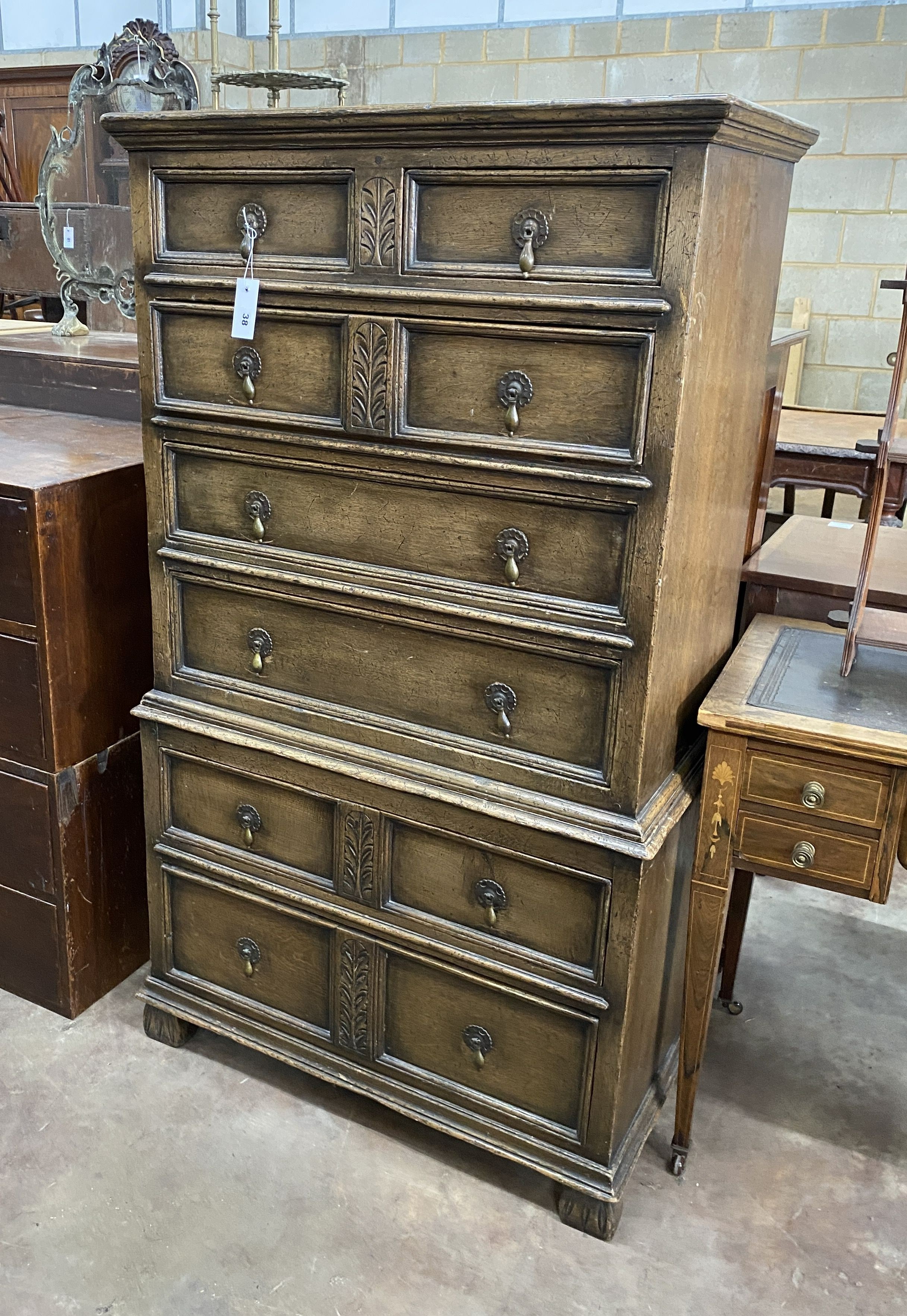 An early 20th century oak chest on chest, width 79cm, depth 45cm, height 140cm